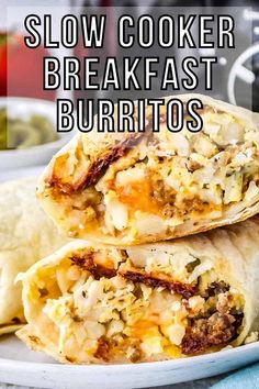 two burritos stacked on top of each other with the text slow cooker breakfast burritos