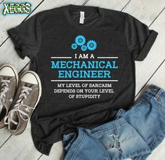 i am a mechanical engineer t - shirt with blue gears on the front and back