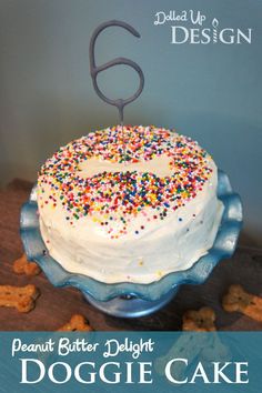 a white cake with sprinkles on it