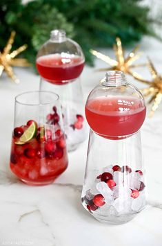 two wine glasses filled with cranberry punch