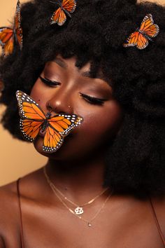 a woman with butterflies on her face