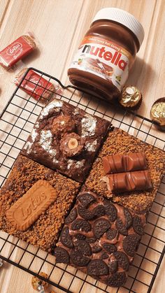 some cookies and candy are on a cooling rack