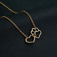 Dog Paw Heart Necklace: A Symbol of Love and Devotion Are you a dog lover looking for a meaningful piece of jewelry to express your love for your furry friend? Look no further than the exquisite Dog Paw Heart Necklace. With its elegant design and heartfelt symbolism, this necklace is the perfect accessory to showcase your bond with your canine companion. Express Your Love with the Dog Paw Love Necklace The Dog Paw Love Necklace is a stunning piece that captures the essence of your affection for your four-legged friend. Crafted with care and attention to detail, this necklace features a delicate heart pendant with a beautifully crafted dog paw design. The pendant hangs gracefully from a chain that is approximately 45 + 5cm in length, allowing it to rest comfortably around your neck. A Timel Therian Ideas, Unique Wedding Earrings, Paw Bracelet, Paw Print Bracelet, Paw Heart, Paw Print Necklace, Gold Armband, Animal Earrings, Pet Necklace