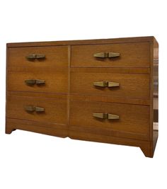 a wooden dresser with many drawers and brass handles