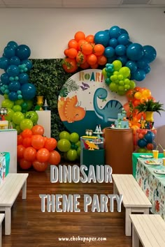 dinosaur theme party with balloons and decorations