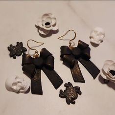 These spooky cute bows are the perfect accessory to any outfit. Hypoallergenic earrings that are nickle free and handmade with polymer clay. Earrings Clay, Bow Earrings, Hypoallergenic Earrings, Black Earrings, Black Ribbon, Ribbon Bow, Cute Bows, Ribbon Bows, Favorite Jewelry