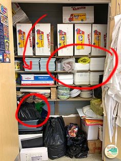 the closet is filled with many items and has red circled circles on the bottom shelf