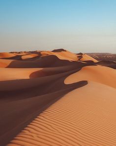 sand dunes in the desert with blue sky