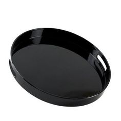 a round black tray with handles on an isolated white background