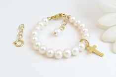 "A classic real freshwater pearl bracelet for newborn, infant, baby, child, or little girl. This bracelet is for her to wear now AND later! This is a wonderful keepsake gift that she can wear at her Baptism/Christening as well as her Confirmation and First CommunionAND on her wedding day! Created with: ~ Grade-A 5.5mm round freshwater pearls ~ 18K gold-plated cross charm ~ 14K gold-filled oval lobster clasp with an attached 1\" \"Grow with Me\" extender chain ~ A separate 1.25\" 14K gold-filled Real Pearl Bracelet, Now And Later, White Pearl Jewelry, 1st Communion, Initial Earrings, Girl Christening, Communion Gifts, Baptism Girl, Freshwater Pearl Bracelet