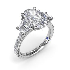 an oval cut diamond engagement ring with side stones