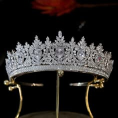 a tiara is displayed on a metal stand