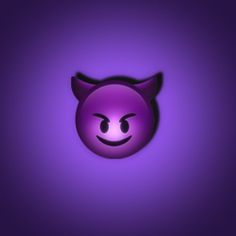 a purple wall with a devilish face on it