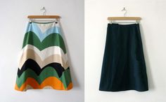 two different skirts hanging on a wall next to each other, one in green and the other in orange