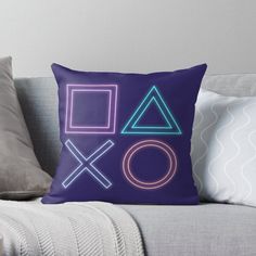 a neon throw pillow on a couch with the word'xo'in front of it