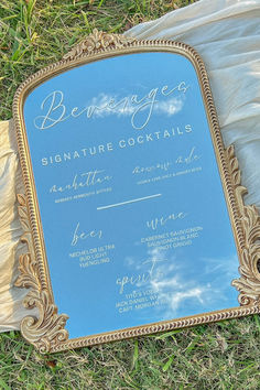 Custom Bar Menu and Cocktail List for Your Wedding
Introducing the exquisite Gold Arch Bar Menu Mirror Sign, a sensational display of all of the delicious beverages that are offered at your wedding. This elegant menu is custom designed to elevate the experience of your special event. Crafted with meticulous attention to detail, our menu promises a delightful fusion of opulence and sophistication. #weddingdecor #cocktailmenu #barmenu #cocktaildrinks #wedding #bar #decor #weddinginspo #wedding2024 Bar Menu Mirror, Gold Arch Mirror, Wedding Cocktail Bar, Mirror Wedding Signs, Arch Bar, Menu Signage, White Arch, Drink Display, Signature Cocktails Wedding