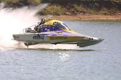 a speed boat is speeding across the water