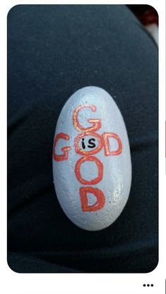 a rock with the word god is painted on it