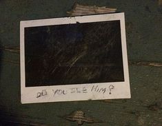 an old polaroid with writing on it that says do you see him?