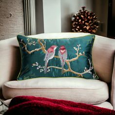 two birds sitting on a tree branch embroidered pillow