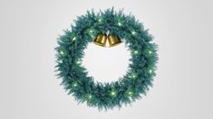 a christmas wreath with two bells hanging from it's sides and green tinsel