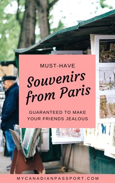 the words must have souvenirs from paris, surrounded by pictures and people walking around