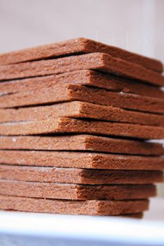 a stack of cookies sitting on top of a white plate