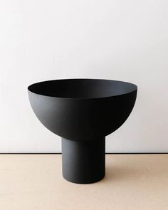 a black bowl sitting on top of a table