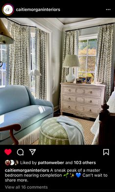 a living room filled with furniture next to a window covered in curtains and drapes