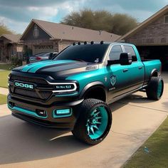 a blue and black truck parked in front of a house