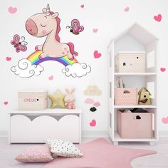 a child's bedroom with pink hearts and a unicorn wall decal