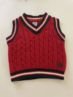 Janie and Jack Infant Boys Red Sweater Vest Size 3-6 Months Red Cable Knit Navy White and Red Striped trim around neck and sleeve openings Good preowned condition - no holes, stains or snags - see photos Size 3-6 Months Check measurements to ensure fit See photos actual measurements Armpit to armpit 10" Back of neck to hem 11 1/2" Ships US Mail - we ship out FAST - same day or next business day Shopify Balance, Cable Knit Sweater Outfit, Red Sweater Vest, Baby Boy Vest, Sweater Outfits Men, Red Cable Knit Sweater, Knit Sweater Outfit, Boys Vest, Mens Fashion Wear