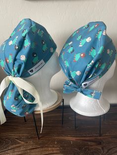 Scrub cap with ponytail holder that has an adjustable ribbon tie to secure any length hair, keeping your hair protected, pulled back out of the way as part of your daily PPE. ~REUSABLE ~WASHABLE ~PRE-WASHED w/ laundry sanitizer  🦋Buttons can be added for an additional $4.00 to help secure face mask to help avoid ear irritation. 🦋Caps are made with 100% Cotton fabric, most ties are made with grosgrain ribbon that can be easily cinched to secure hair in pouch. 🦋Each cap is handmade which sometimes creates a slight differ in the pattern of the fabric. 🌸Made in Las Vegas, NV🌸 Caps designed for the hospital, Surgery setting, dental office, under helmets, chemo head covers....anywhere full coverage is needed to keep you safe, protected, and sometimes a nice addition to put you apart from th Cute Scrub Caps, Cap With Ponytail, Laundry Sanitizer, Cute Scrubs, Hair Cover, Scrub Caps Surgical, Ponytail Holder, Scrub Hat, Cap Hair