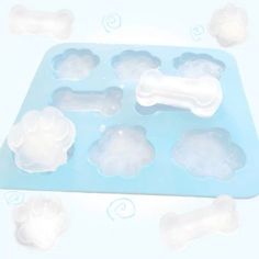 an ice tray filled with lots of white clouds