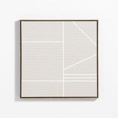 a white square with lines drawn on it in front of a white wall and floor