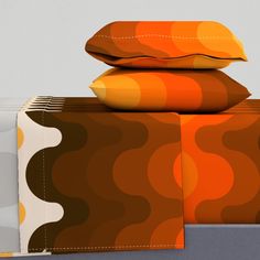 three pillows are stacked on top of each other