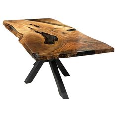 a wooden table with black metal legs and a piece of wood on the top that has been cut into pieces