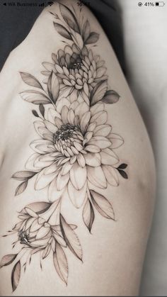 a woman's back with flowers on it