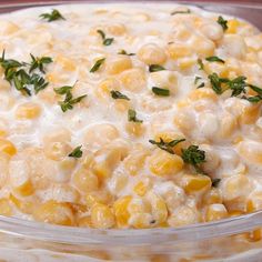 a casserole dish filled with corn and cheese