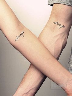 two people holding hands with tattoos on their arms that say, always and always in cursive writing