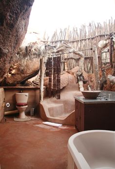 a bathroom with a sink, toilet and tub in it