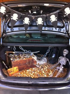 the trunk of a car with skeleton decorations on it