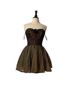 a dress on a mannequin with black and brown laces, in front of a white background