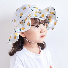 Delightful Summer Hat for Your Little Princess Introducing the Adorable Fruit Print Cotton Bucket Hat, a perfect blend of style, comfort, and protection for your baby girl. This charming hat, designed for toddlers aged 1-3 years, is an essential accessory for summer, autumn, and spring outings. Whether you are heading to the beach, a picnic, or just a stroll in the park, this hat will keep your little one looking cute and feeling comfortable. Charming Design and Comfortable Fit Our bucket hat features a delightful fruit print that adds a splash of fun to any outfit. Made from high-quality cotton, this hat is soft, breathable, and gentle on your baby's delicate skin. The hat circumference of 19.3-20 inches ensures a snug and secure fit, while the adjustable bow tie allows you to customize t Baby Summer Hat, Hat For Baby, Kids Bucket Hat, Cotton Bucket Hat, Child Smile, Family Picnic, Spring Wear, Toddler Age, Summer Hat