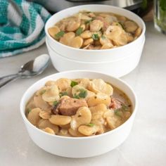 two white bowls filled with soup next to an instant pot