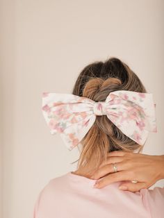 Add a pop of color to your hairstyle with this Floral Watercolor Hair Bow! Made with a vibrant floral watercolor print, this hair accessory features a secure alligator clip that will keep it in place all day long. Make a statement and stay stylish with this must-have accessory. Details Structured Satin Ribbon Floral Watercolor Print Alligator Clip 9 Inches Wide 5 Inches Long Watercolor Hair, Watercolour Hair, Quilted Outerwear, Classic Closet, Color Picker, Your Hairstyle, Floral Accessories, Skirt Co Ord, Jumpsuit Shorts Rompers