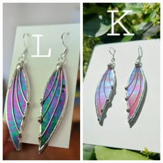 the earrings have been made to look like leaf shaped leaves with pink and blue iridescents