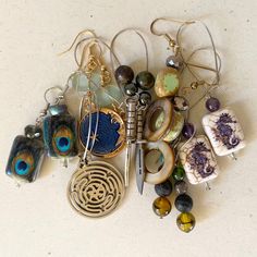 Want a particular earring style or devotional piece that you don't see on the shop? I'm happy to work with you to create the piece that resonates most with you! Spiritual Dangle Earrings For Everyday Wear, Symbolic Nickel-free Drop Plug Earrings, Unique Round Bead Earrings As Gift, Nickel-free Symbolic Drop Plug Earrings, Unique Round Beads Earrings For Gift, Artisan Teardrop Single Earring, Artisan Single Teardrop Earring, Artsy Metal Jewelry, Artisan Dangle Earrings As Gift