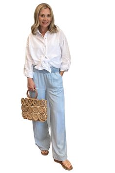 These 100% Tencel wide leg pants provide a comfortable and lightweight fit, with a smocked elastic waist and side pockets. With a classic chambray color, these pants are the perfect addition to any wardrobe. 12" Front Rise (include waistband), 24" Leg Opening, 29 1/4" inseam (Size Small) 100% TENCEL Machine wash cold, Tumble dry low Chambray Wide Leg Pants Outfit, Chambray Pants Outfit, Wide Leg Pants Outfit, Chambray Pants, Leg Pants Outfit, Closet Inspiration, Pants Outfit, Best Mom, Chambray