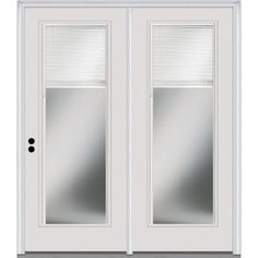 a white double door with blinds on the side